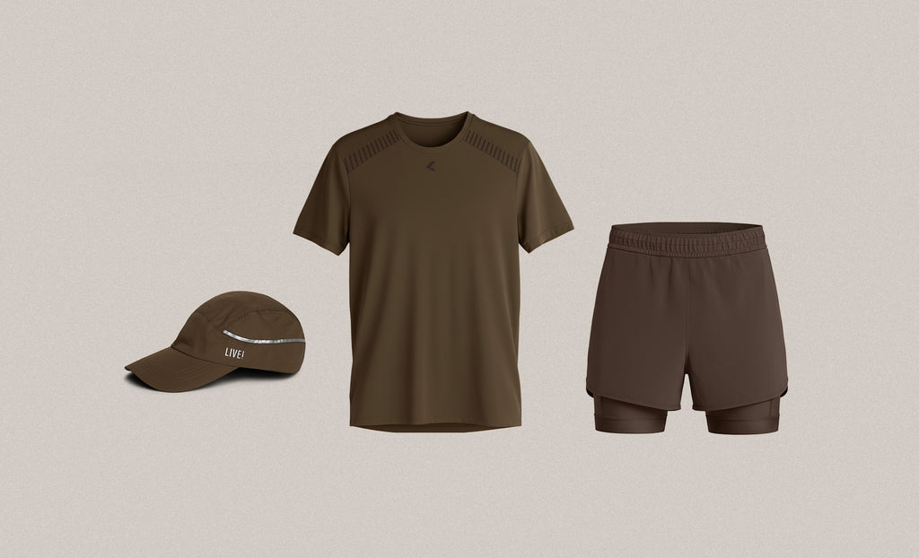A three-piece athletic outfit set in olive brown, including a short-sleeve athletic shirt with textured shoulder panels, matching compression shorts, and a baseball cap, displayed on a solid light beige background.