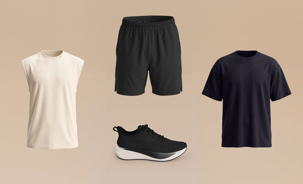 Four apparel items arranged on a warm beige background: an off-white sleeveless crew-neck shirt, black athletic shorts, a black running shoe, and a black short-sleeve T-shirt.