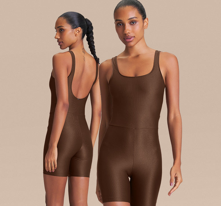Two models wearing a brown shapewear bodysuit, showing both the front and back views against a solid beige background.