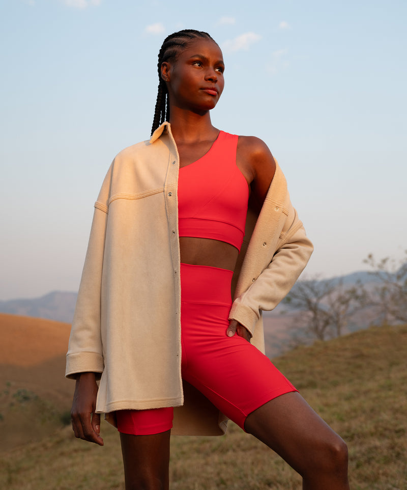 A striking visual showcasing the latest activewear pieces in bold, dynamic colors. The collection exudes energy and versatility, designed to support every move with style.