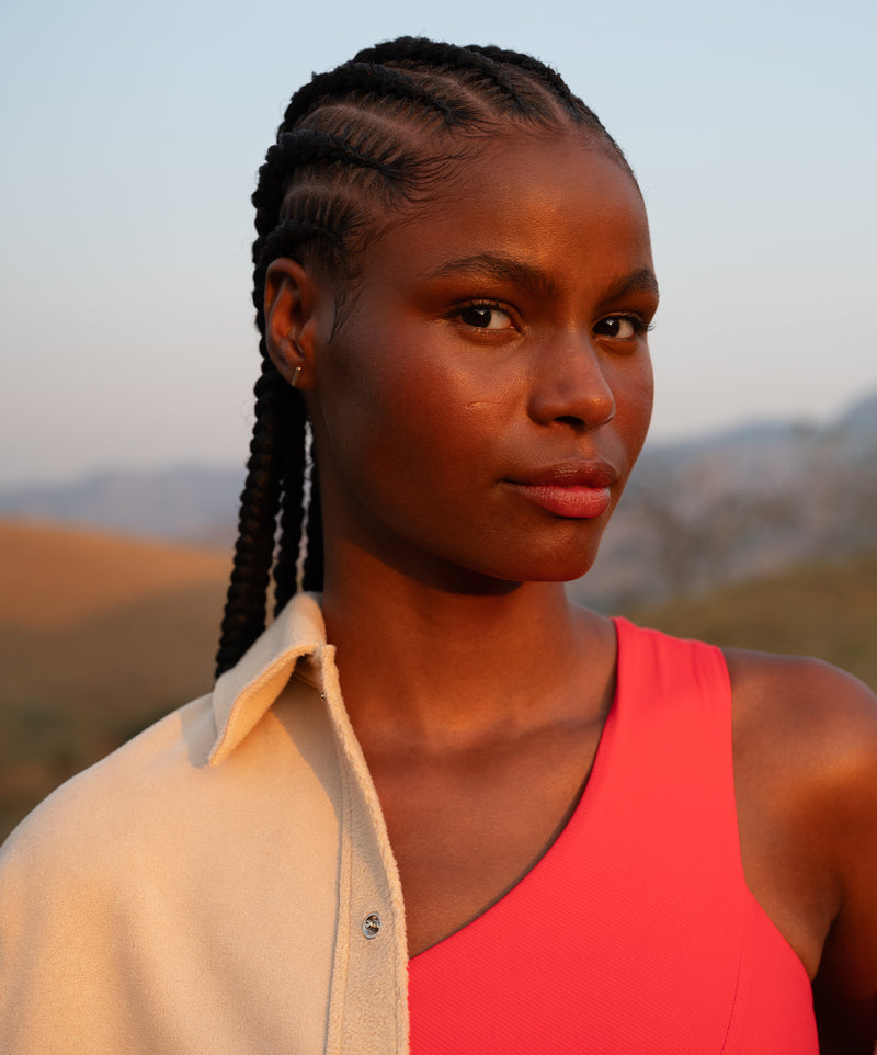 A striking visual showcasing the latest activewear pieces in bold, dynamic colors. The collection exudes energy and versatility, designed to support every move with style.
